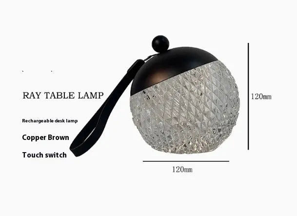 Small portable desk lamp with touch dimmer in gold finish, 12cm tall.