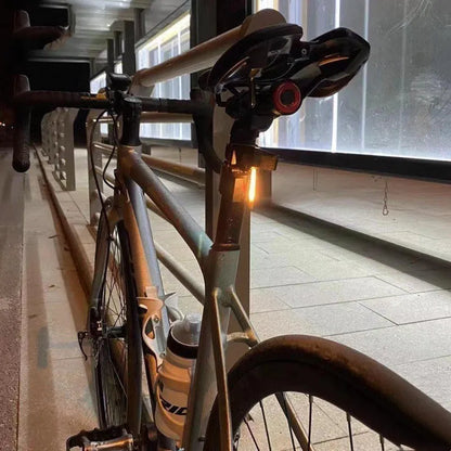 Waterproof USB rechargeable bicycle tail light in blue, pink, red, white, or yellow colours