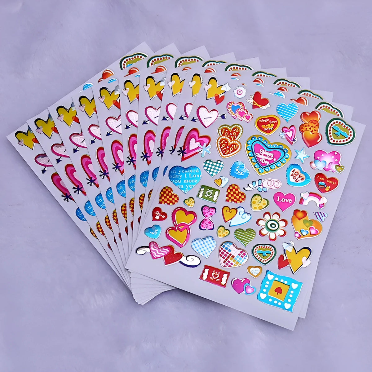 100 gold foil glitter heart reward stickers on backing sheet, approximately 20mm diameter