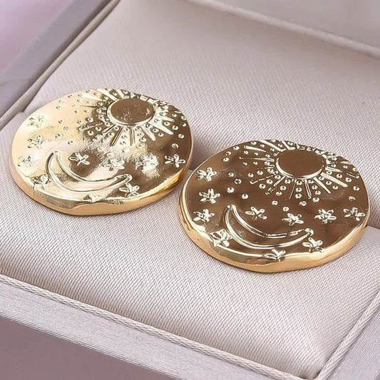 Pair of geometric shell design stud earrings in stainless steel with gold or silver electroplated finish
