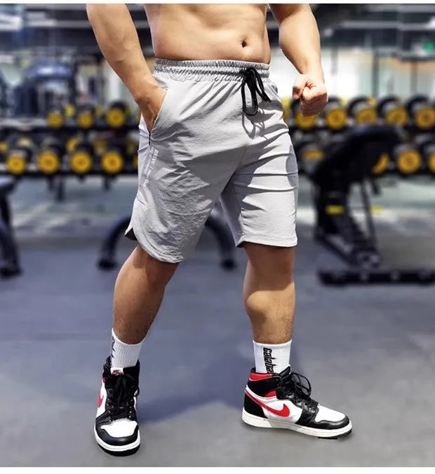 Sports quick-drying running shorts for men in thin polyamide and spandex blend fabric, available in black, blue and grey colour options with sizes M, L, XL, 2XL and 3XL for athletic comfort during exercise