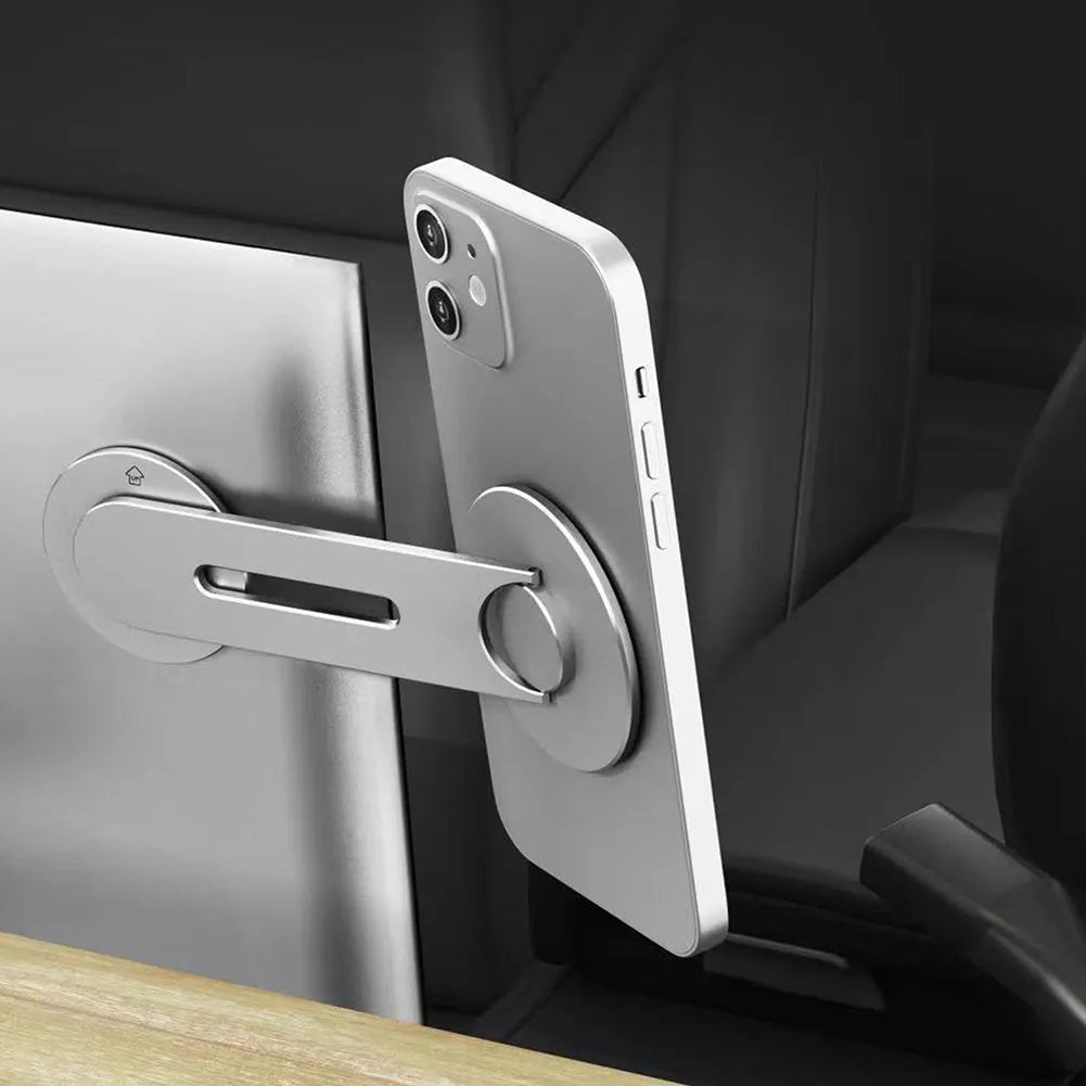 Silver aluminium alloy magnetic phone holder for Tesla vehicles showing 180-degree rotation mechanism
