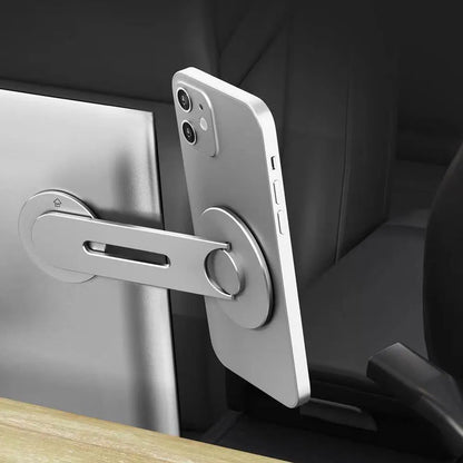 Silver aluminium alloy magnetic phone holder for Tesla vehicles showing 180-degree rotation mechanism