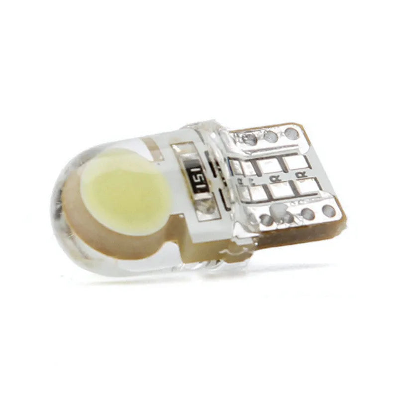 Pack of ten T10 wedge base LED car bulbs with COB chips in various colours on a white background