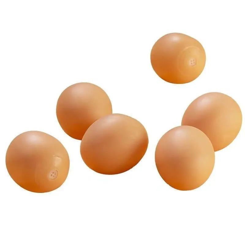 Durable rubber dog chew toy shaped like an egg with sound simulation for puppy teeth cleaning