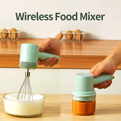 Green rechargeable electric hand mixer with whisk and beater attachments on a kitchen counter