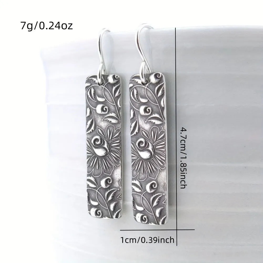 Geometric long earrings with carved vine pattern in silver zinc alloy