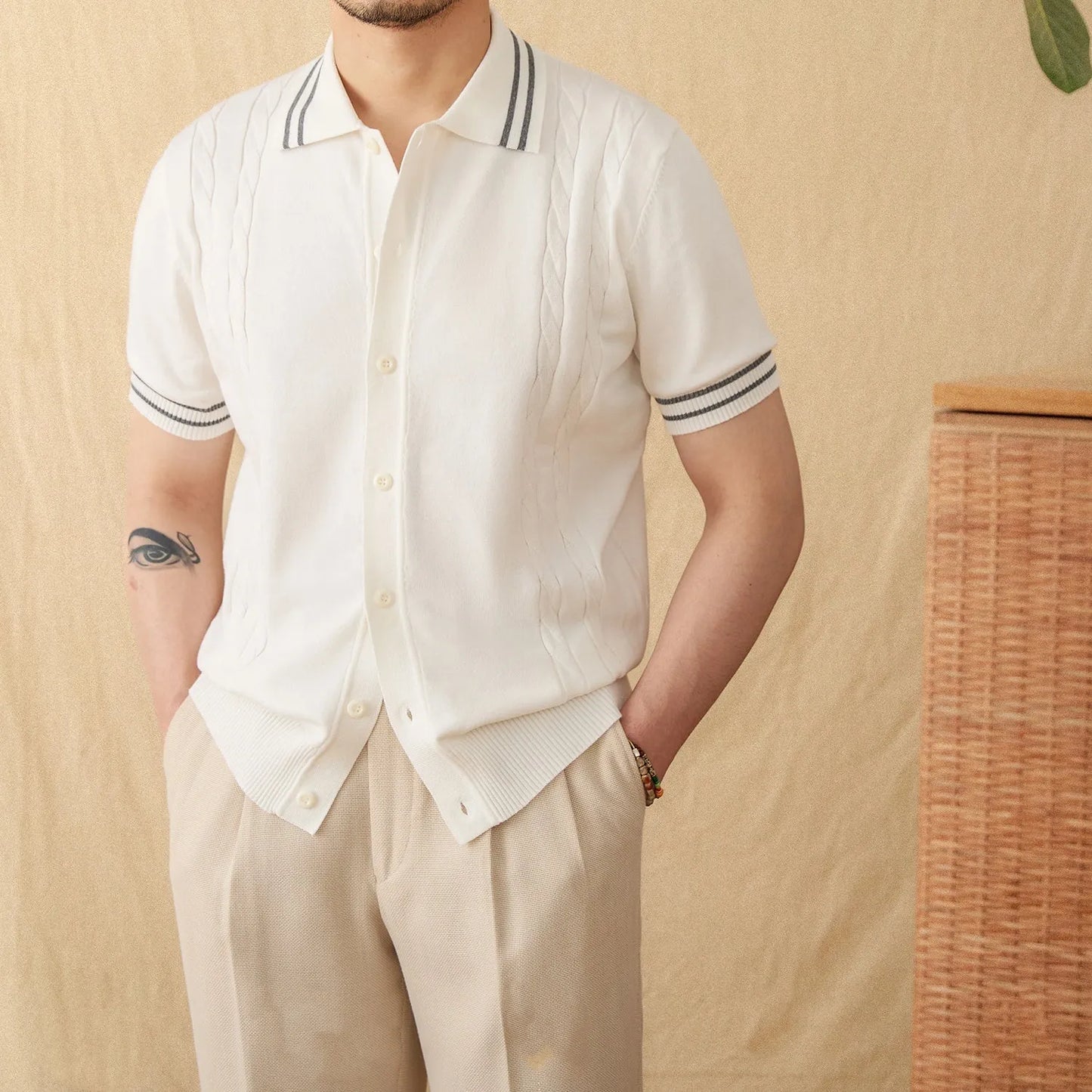 Men's apricot-coloured short-sleeved polo shirt with a lapel collar, laid flat.