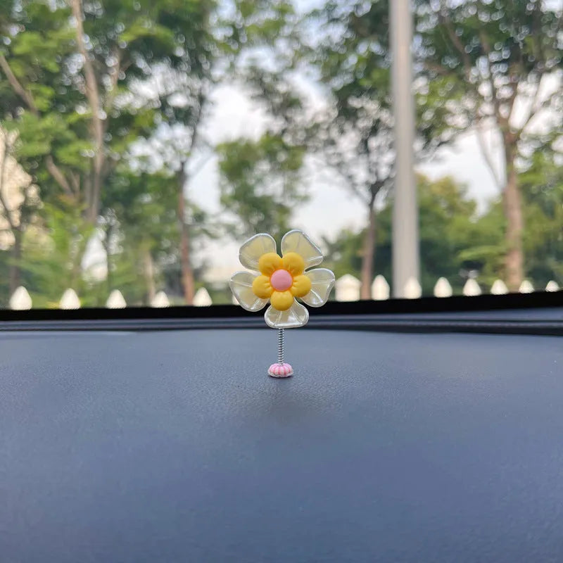 Small plastic car decoration swing measuring 5cm tall in blue, green, pink, purple, and yellow colour options