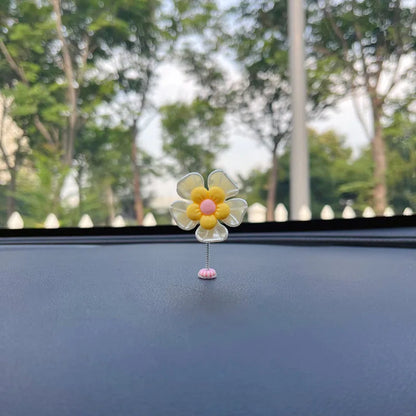 Small plastic car decoration swing measuring 5cm tall in blue, green, pink, purple, and yellow colour options