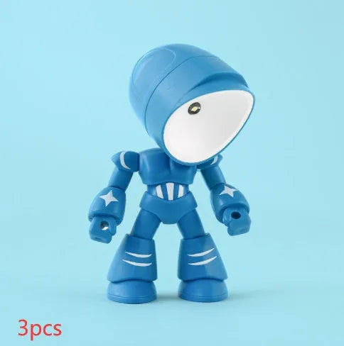 Mini mecha robot hero LED night light with adjustable arms on a desk.