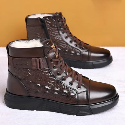 Men's brown genuine leather lace-up snow boots with fur lining and deep-tread rubber sole on a wooden surface.