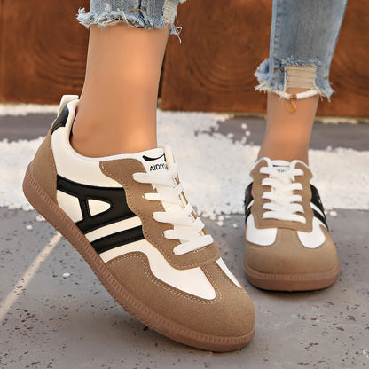 Women's retro lace-up jogging shoes in black, grey, and khaki with low platform heel.