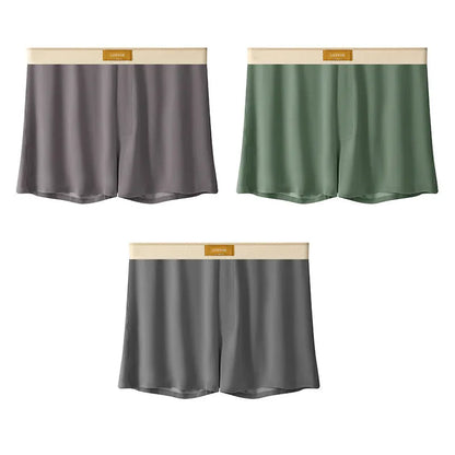 Pack of three pairs of solid colour men's ice silk briefs on a white background