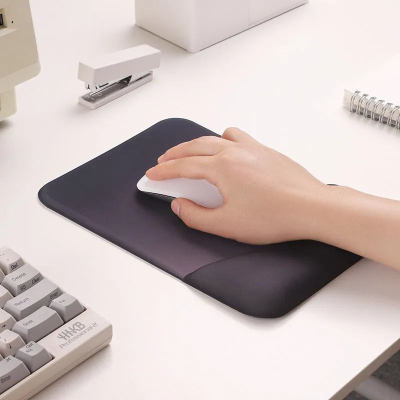 Square cloth-covered silica gel wrist rest mouse pad on a desk.