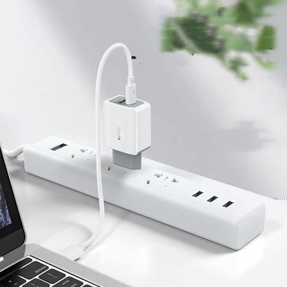 White phone fast charger set with compact charging head and USB cable on a white background.
