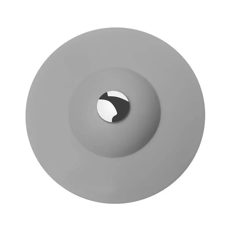 UFO-style silicone press sink drain cover in white, pink, gray, blue, and green