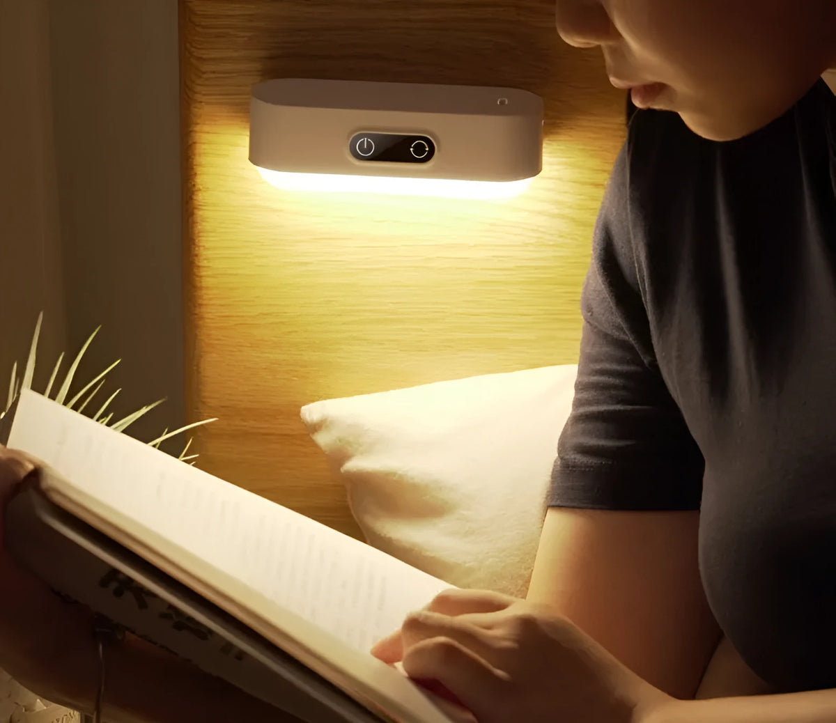 White magnetic USB rechargeable LED night light with touch controls, shown attached to a metal surface.