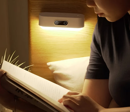 White magnetic USB rechargeable LED night light with touch controls, shown attached to a metal surface.