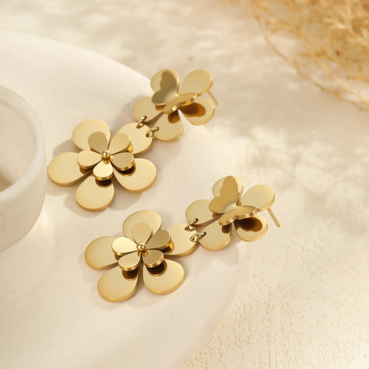 Gold colour flower butterfly stainless steel earrings for women with geometric and zodiac design elements
