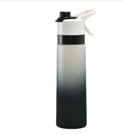 White spray water bottle with black leakproof lid and handle strap on a table