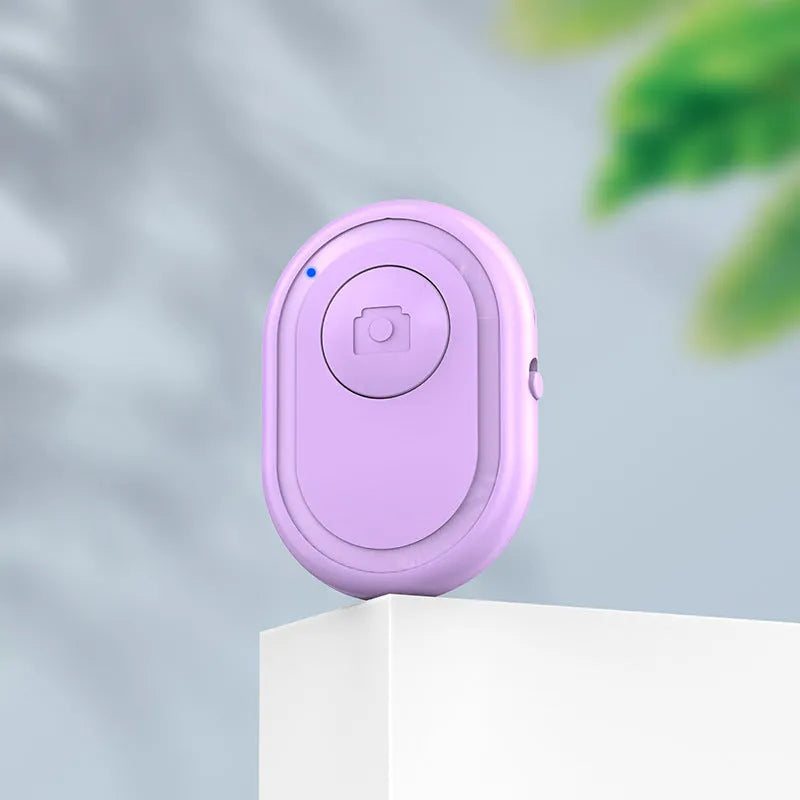 Black wireless Bluetooth remote control for cameras with tripod mount thread