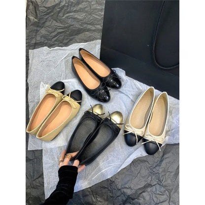 Apricot flat ballet shoes with a bowknot, round toe, and soft rubber sole.