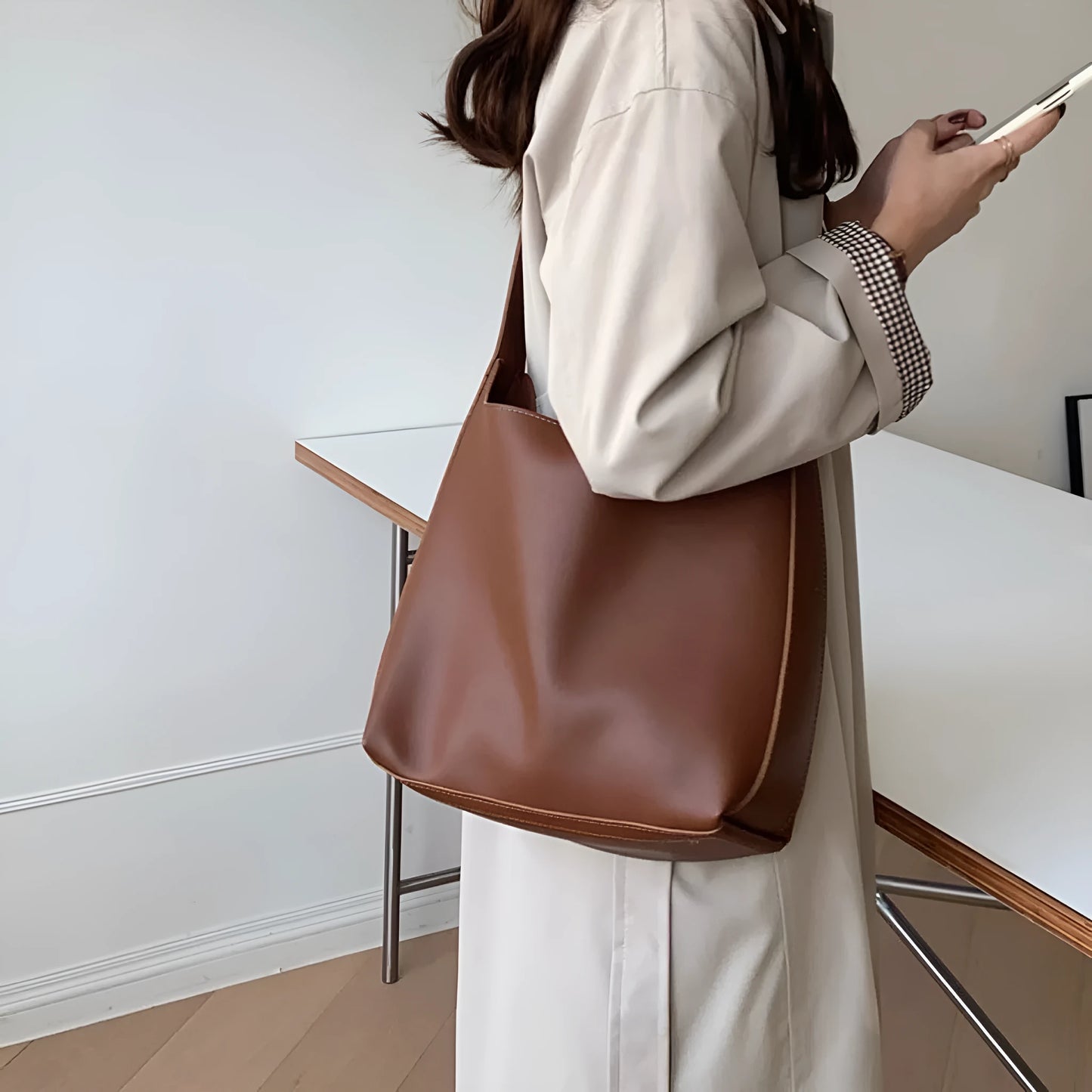 Women's soft PU shoulder bag measuring 28cm by 32cm by 12cm with swing thread details