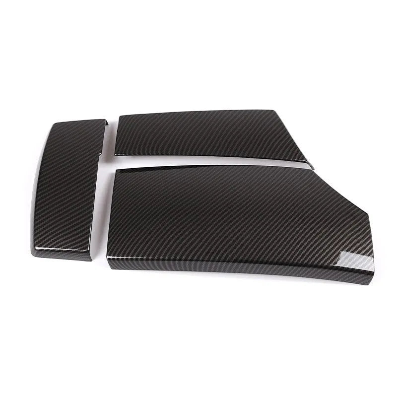 Set of three black ABS armrest box covers with a diagonal carbon fibre weave pattern and polished surface.