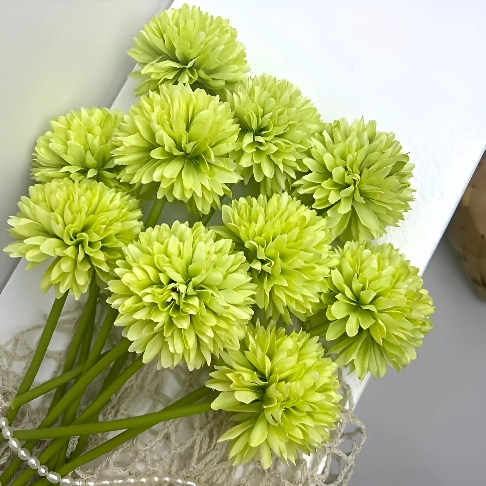 Silk artificial flower desktop decoration in green colour options measuring 20cm tall