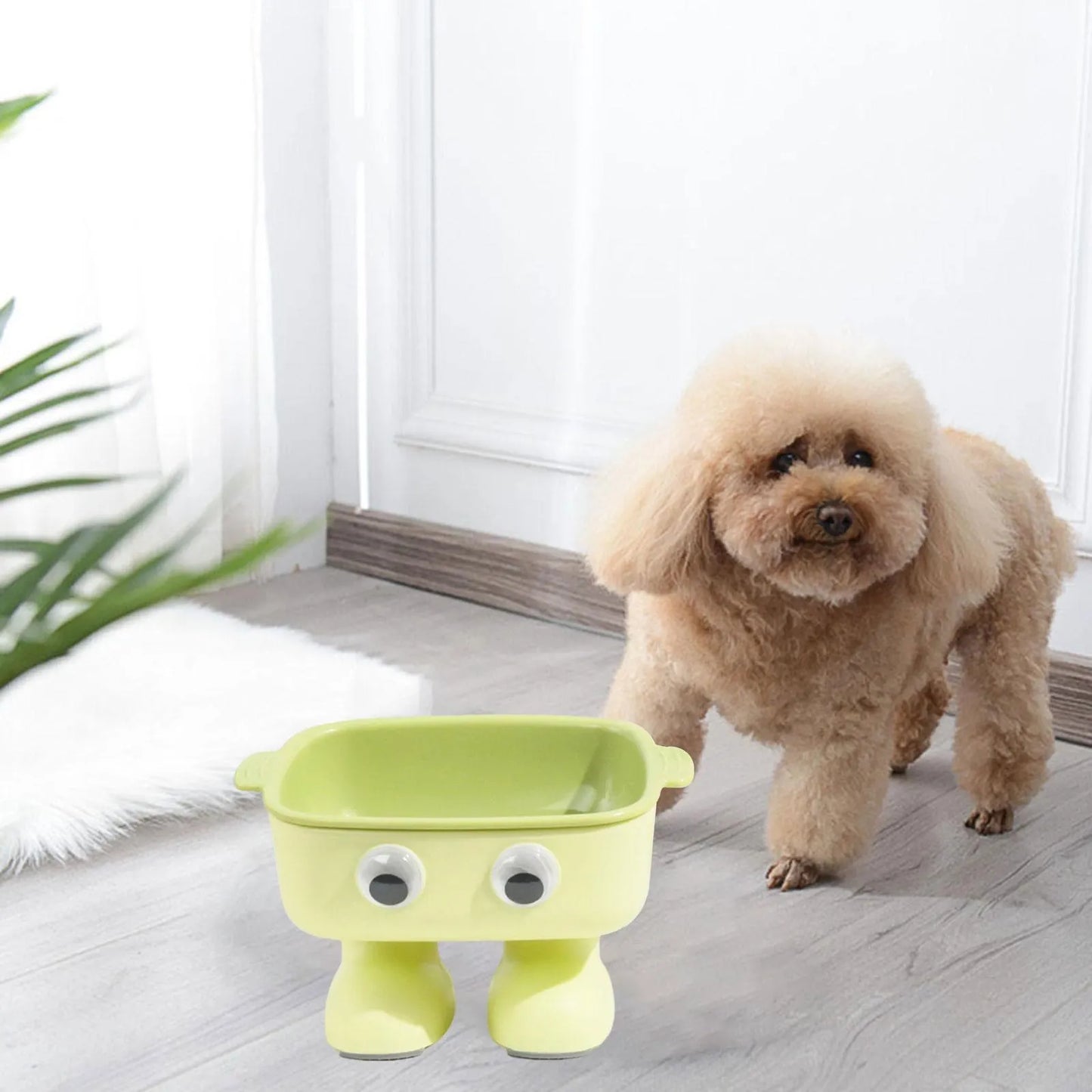 Robot-shaped elevated cat bowl with 15 degree tilt in green colour with detachable inner bowl