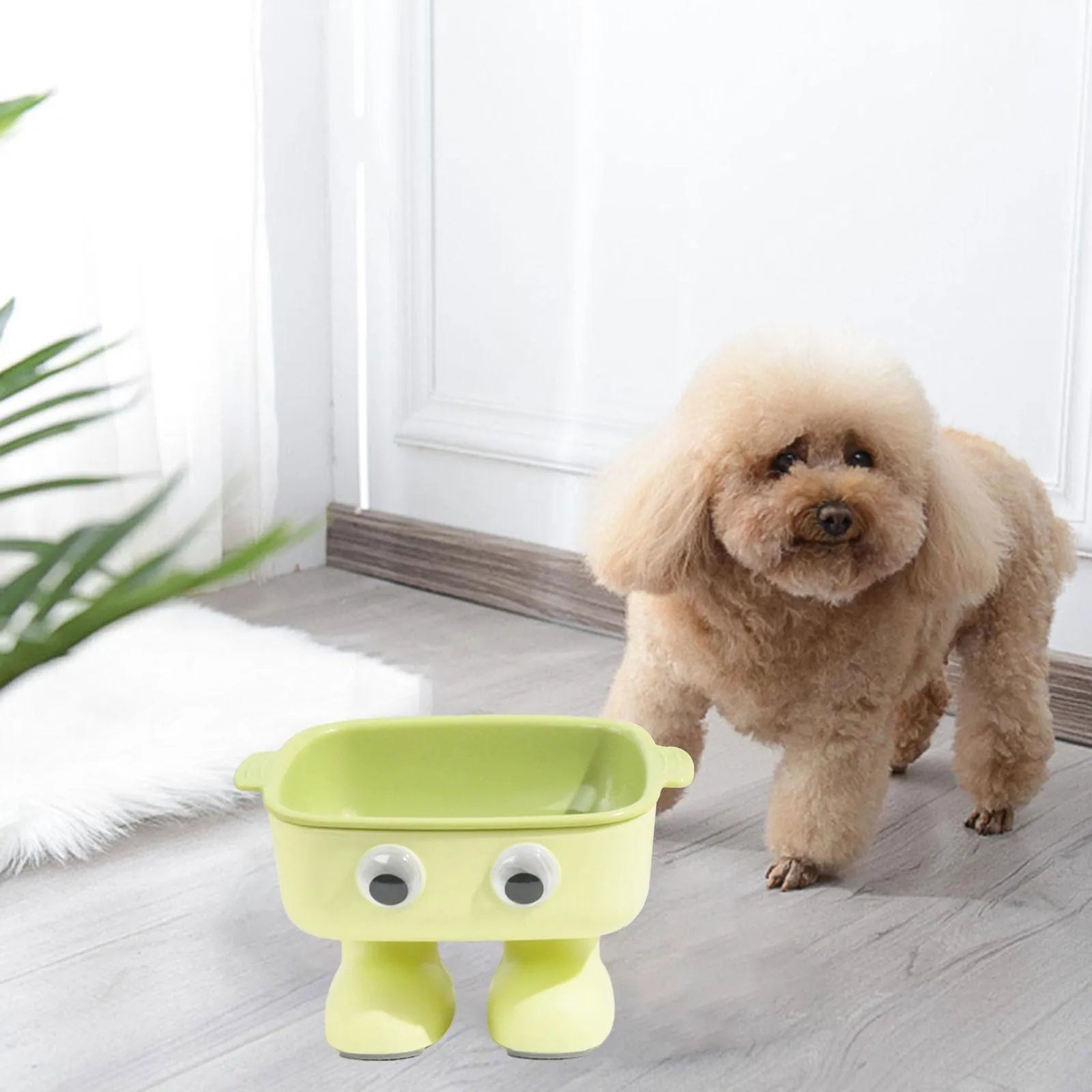 Robot-shaped elevated cat bowl with 15 degree tilt in green colour with detachable inner bowl