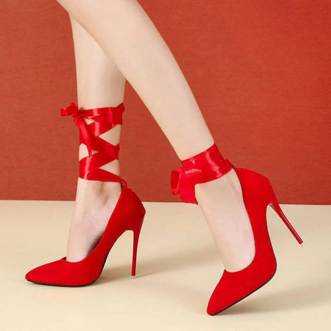 Women's black thin shallow mouth strap high heels with pointed toe on a white background