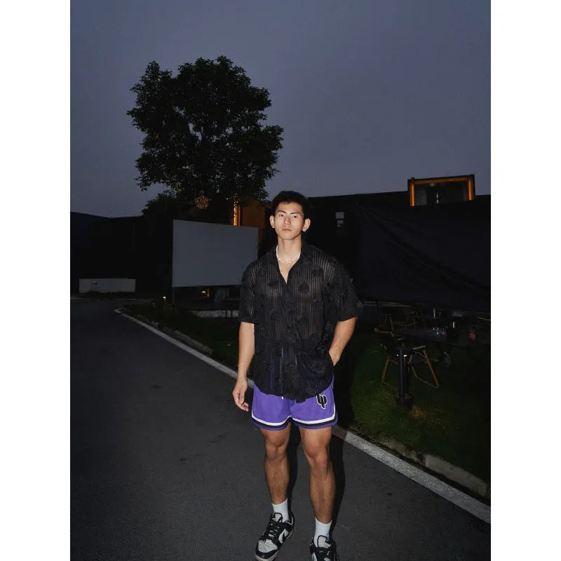 Men's loose fit floral print short sleeve shirt in black with a wool lining, shown on a mannequin.