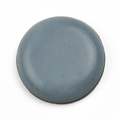 Blue grey 22mm adhesive slip pads attached to chair legs, preventing slides on hardwood floor, pack of 8