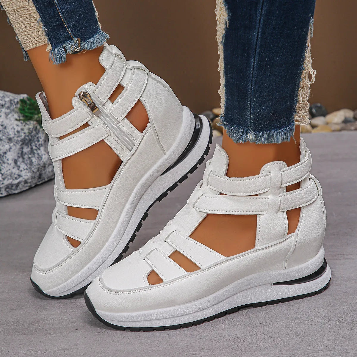 Black women's close-toed platform sandals with hollow-out design and Velcro strap.
