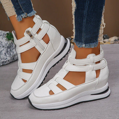 Black women's close-toed platform sandals with hollow-out design and Velcro strap.