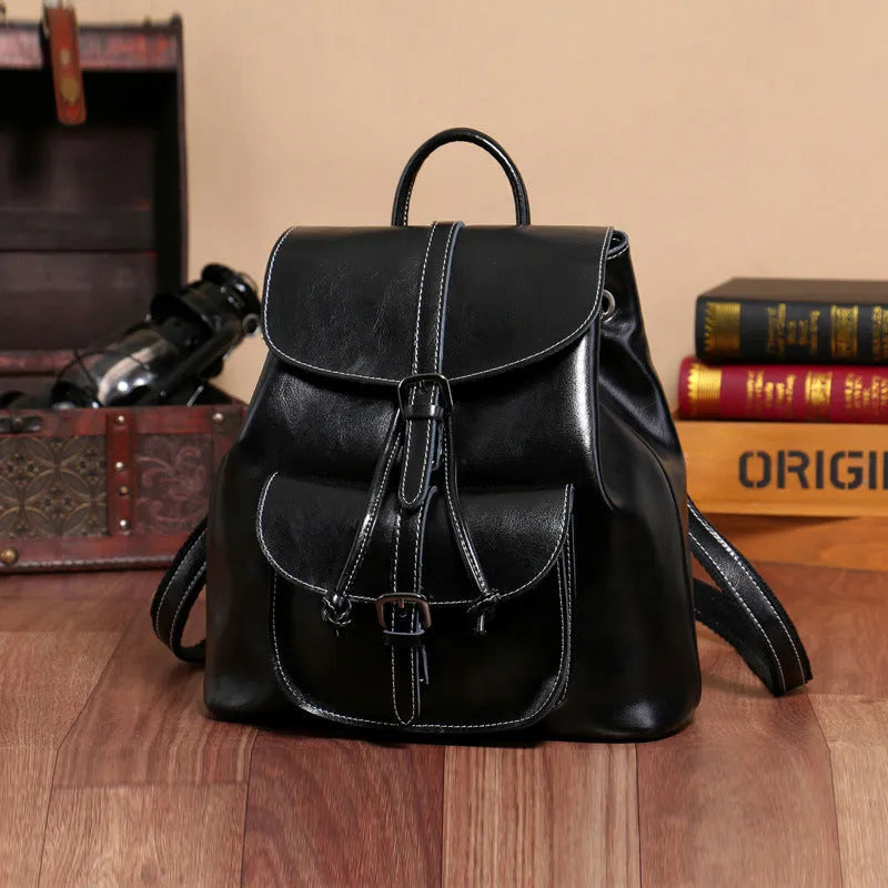 Korean style cowhide leather backpack in black with front sandwich pockets and internal organisation compartments
