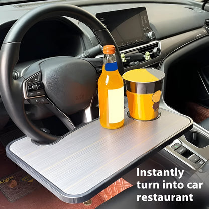Foldable black car laptop and dining tray with cup holder on a steering wheel