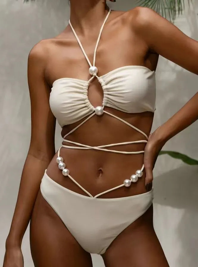 Women's black lace-up bikini swimsuit showing adjustable design and two-piece construction