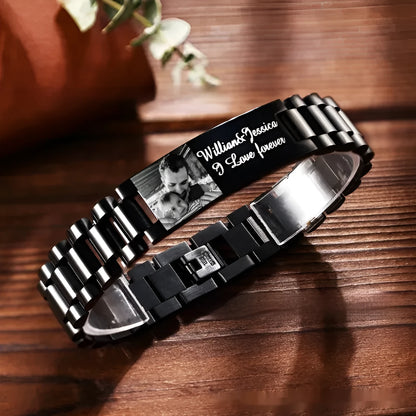 Men's titanium steel bracelet with curved heart shape and black electroplated lettering on wrist.