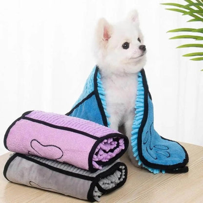 Blue dog bath robe towel laid flat, showing its 62cm by 23cm size and soft texture.