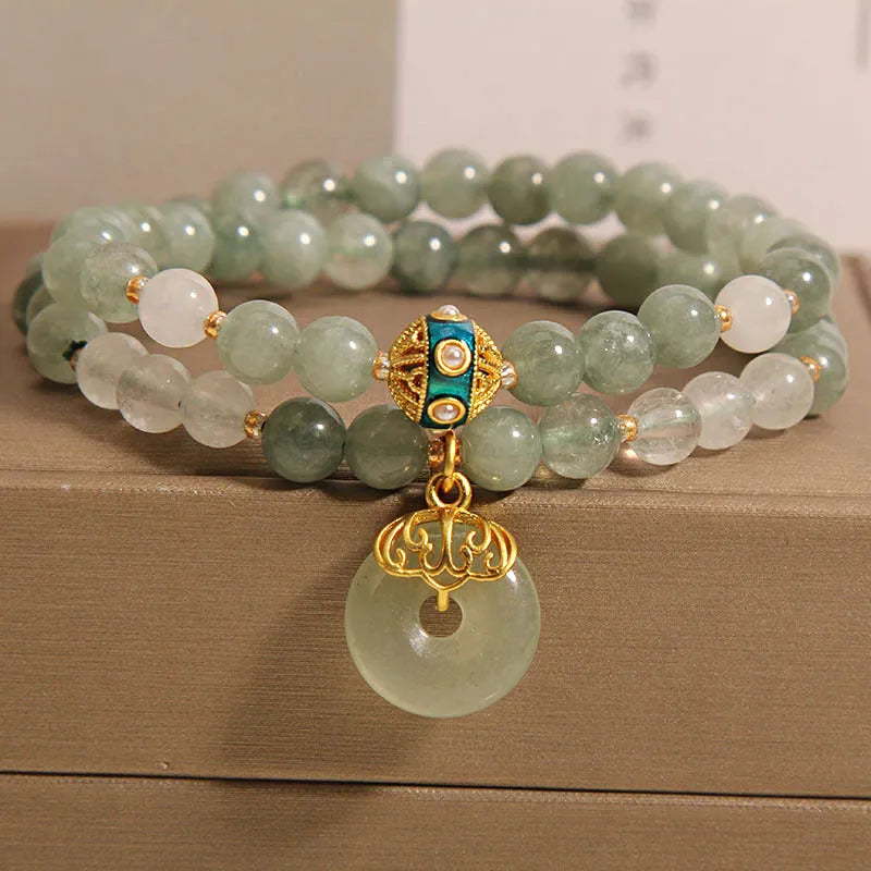 Women's aventurine double-layer jade bracelet with peace buckle closure and rhinestone details