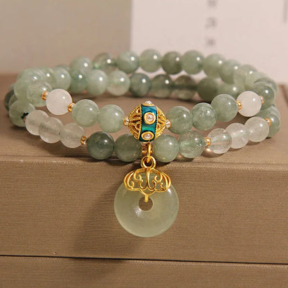 Women's aventurine double-layer jade bracelet with peace buckle closure and rhinestone details