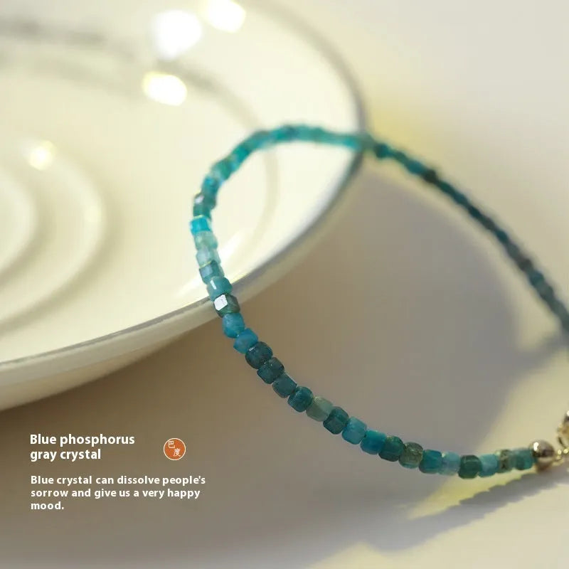 Women's blue apatite crystal bracelet with diamond-cut stones on wrist