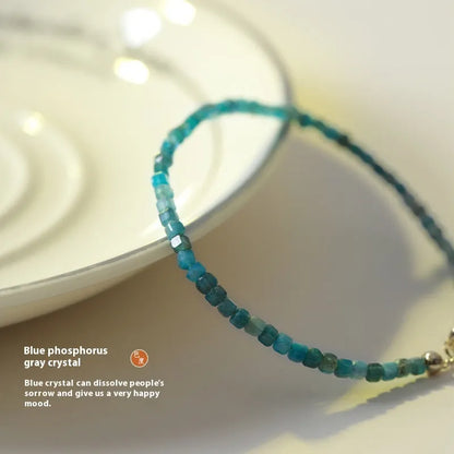 Women's blue apatite crystal bracelet with diamond-cut stones on wrist
