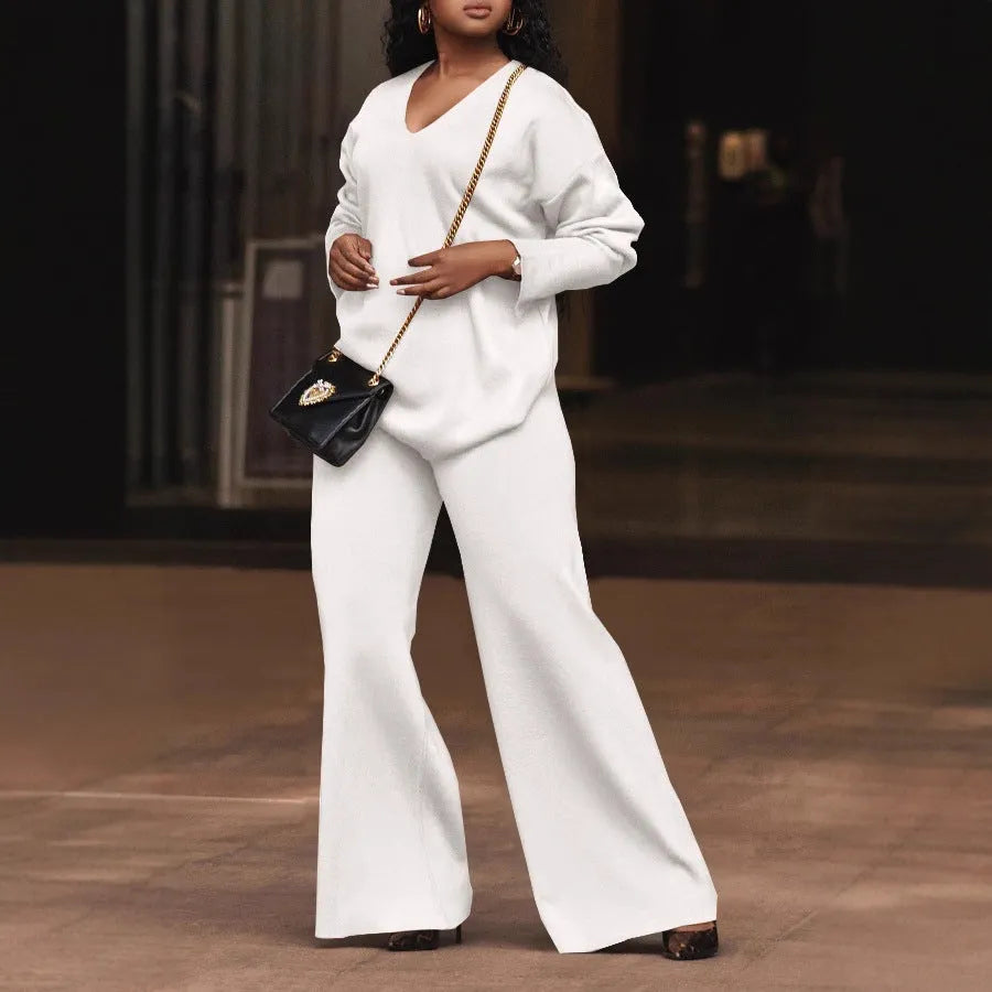 Women's brown suede two-piece suit with split sleeves on top and matching trousers