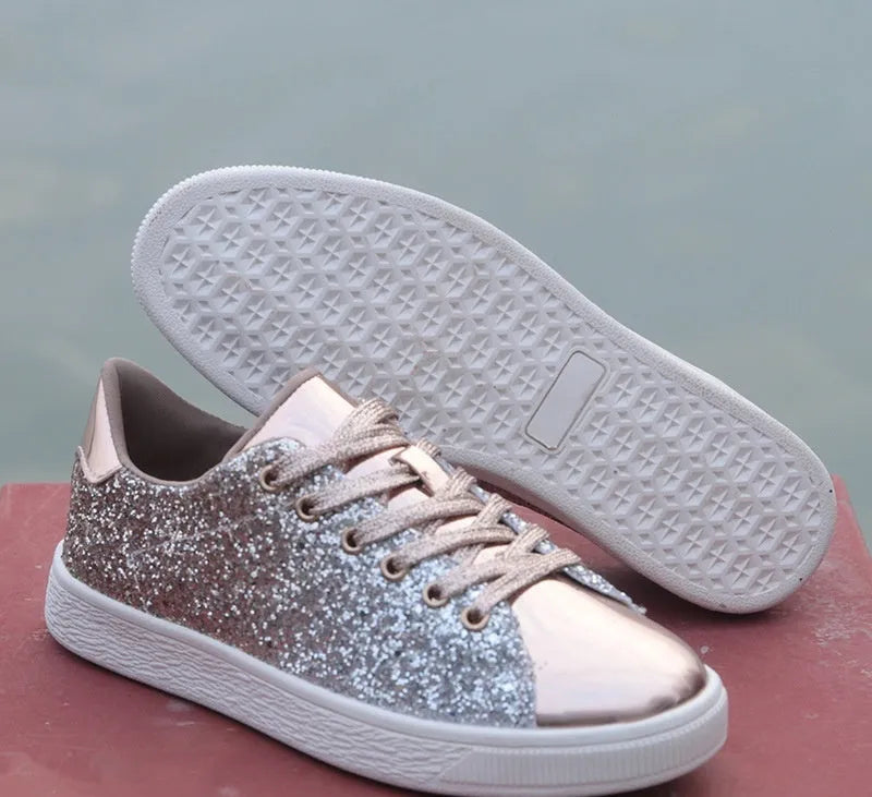 Women's low-top casual shoes with black sequin upper, round toe, and white rubber sole with lace-up closure.