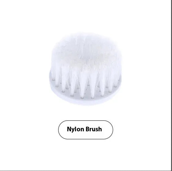 White cordless electric spin scrubber with multiple brush heads on a bathroom tile.