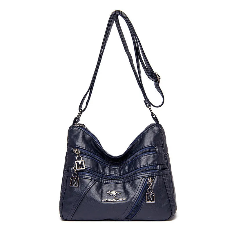 Middle-aged women's double layer PU shoulder bag with large capacity, welt pocket, and soft build in red, purple, dark blue, black, bronze, gray, or tan.